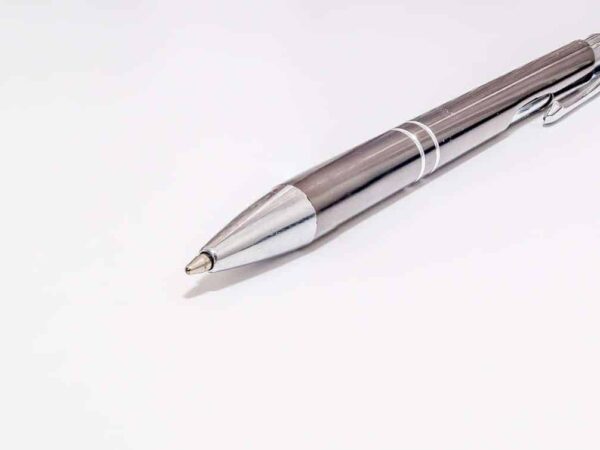 Silver ballpoint pen on a white background