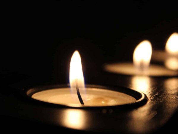 Tea light candles burning in the dark