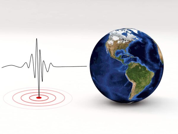 Earthquake illustration | Science Safety Illustration of the Earth beside a seismograph line and an epicentre target