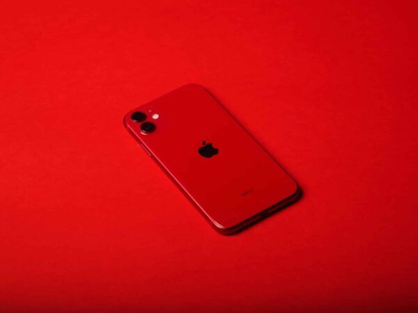 Red smartphone | Science Safety Red smartphone lying on a red background