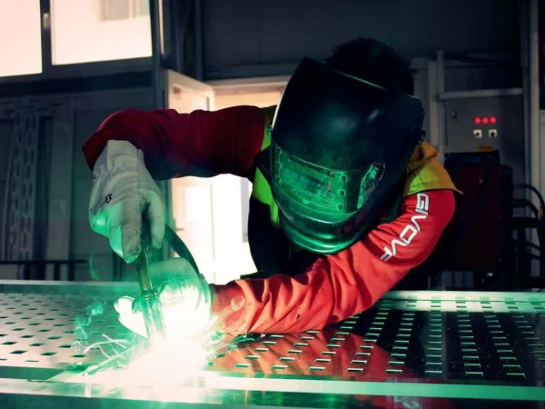 Welder at work with sparks