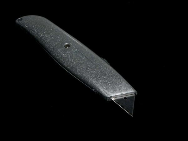 Utility knife | Science Safety Utility knife (box cutter) on a black background