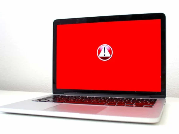 Laptop screen showing a red warning symbol