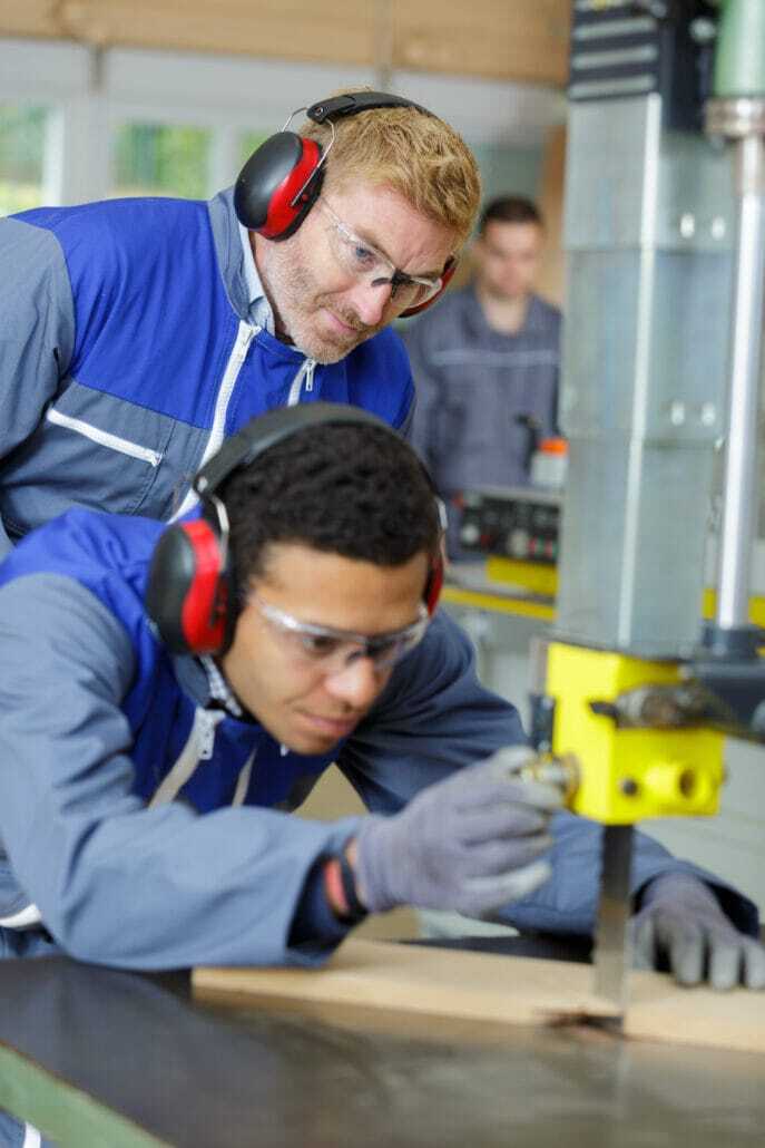 Back to School for High School CTE Teachers | Science Safety | Science Safety A student in safety glasses and ear protection working at a shop machine