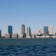 city skyline across body of water during daytime